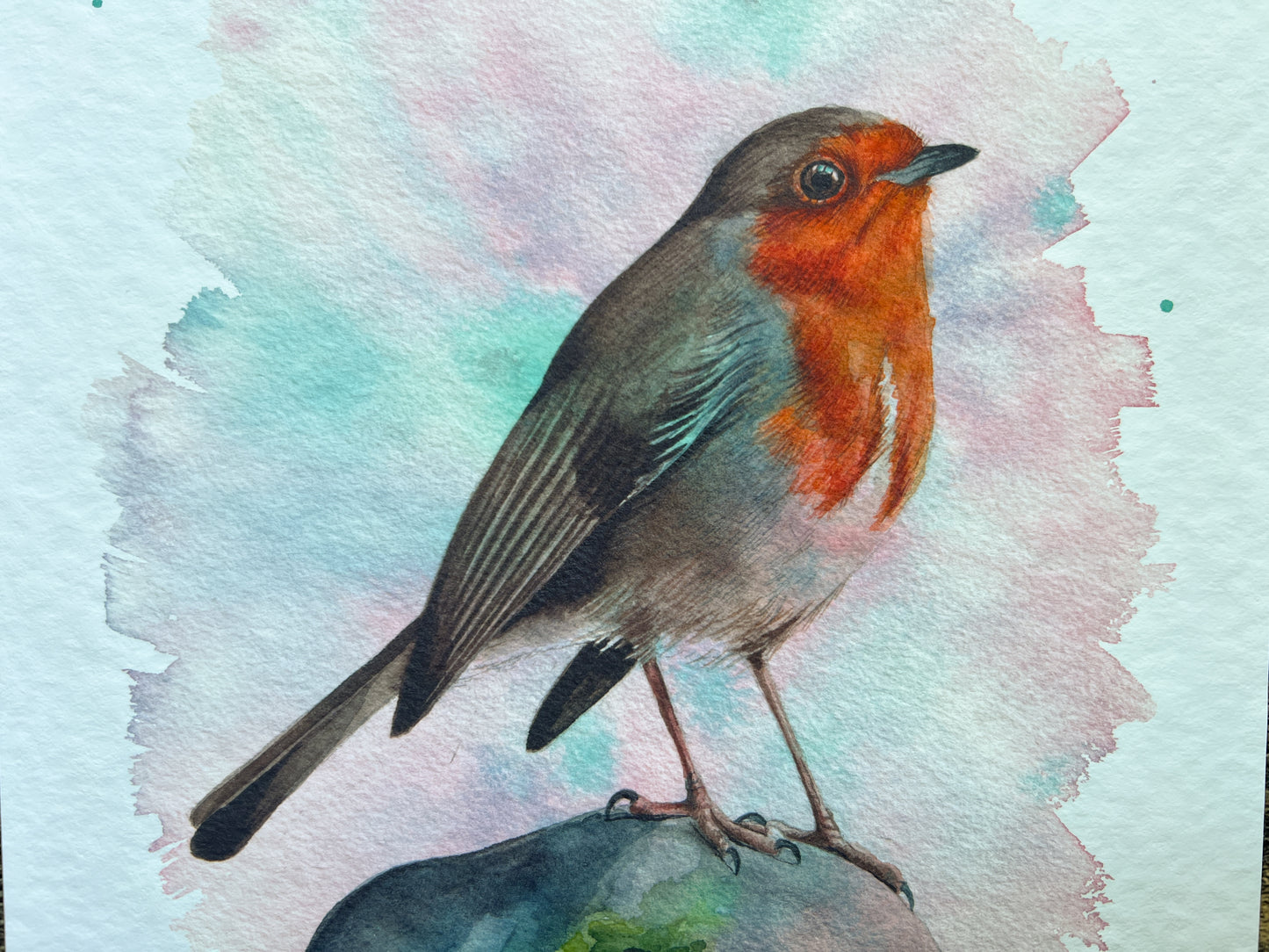 A watercolour print of a robin surrounded by spring colours