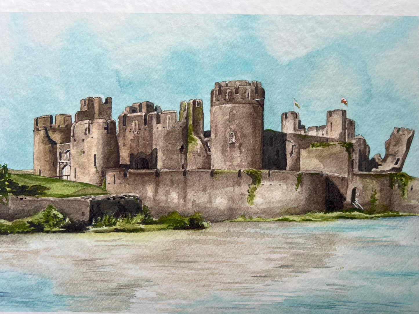 A photograph of a watercolour print depicting Caerphilly castle