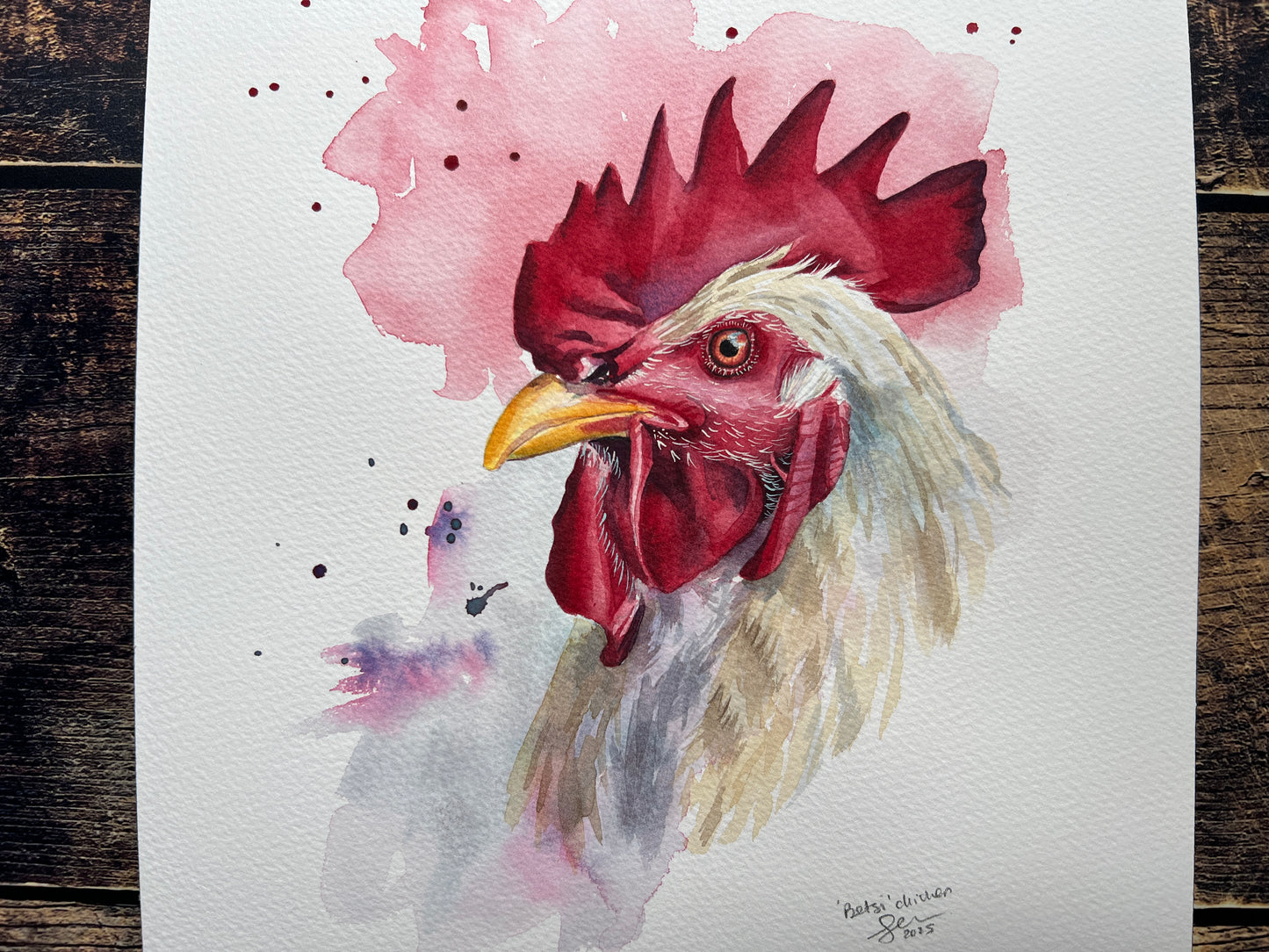 Watercolor painting of a rooster on a textured wooden surface