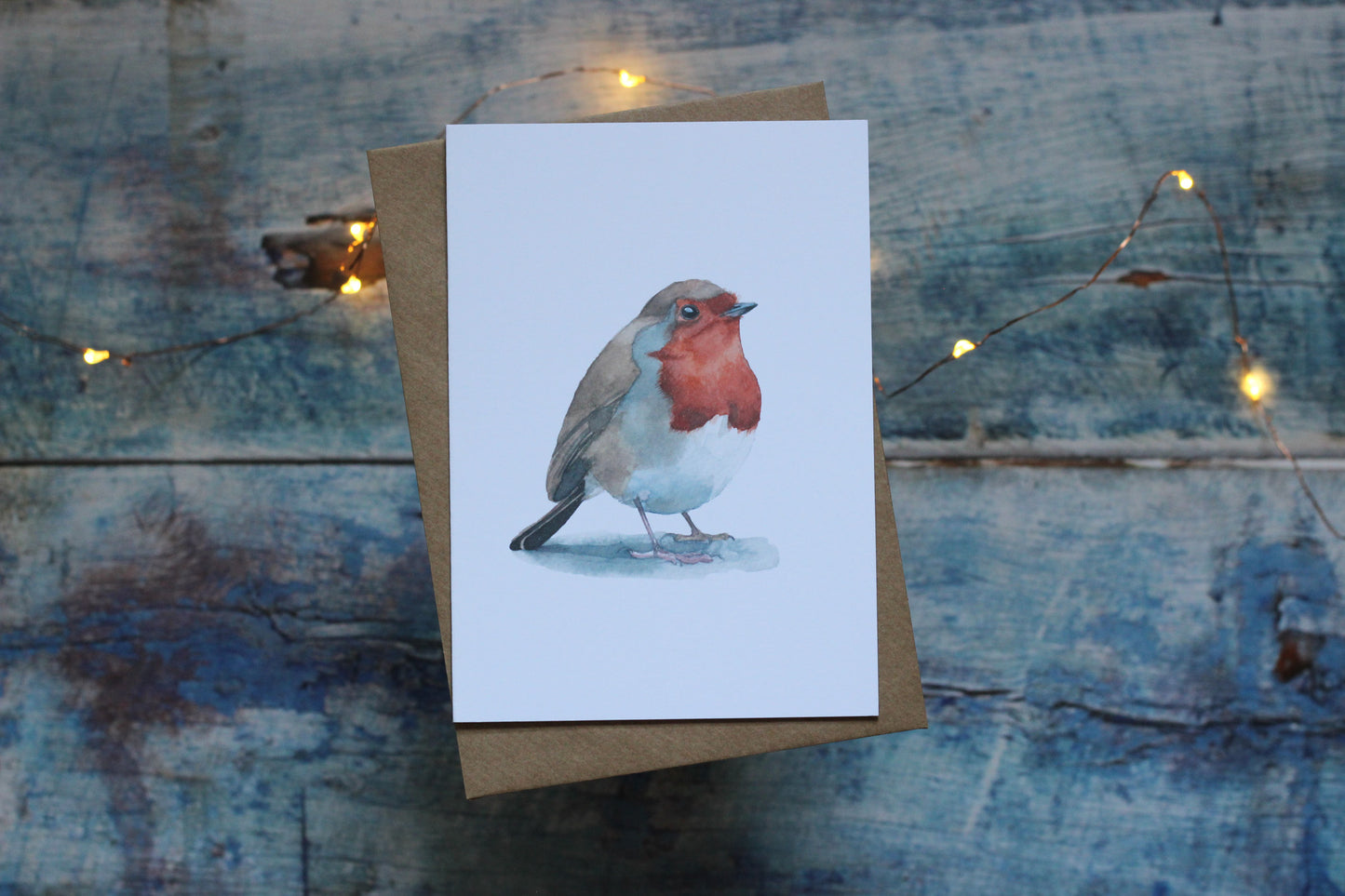 An A6 card and brown kraft envelope featuring a robin