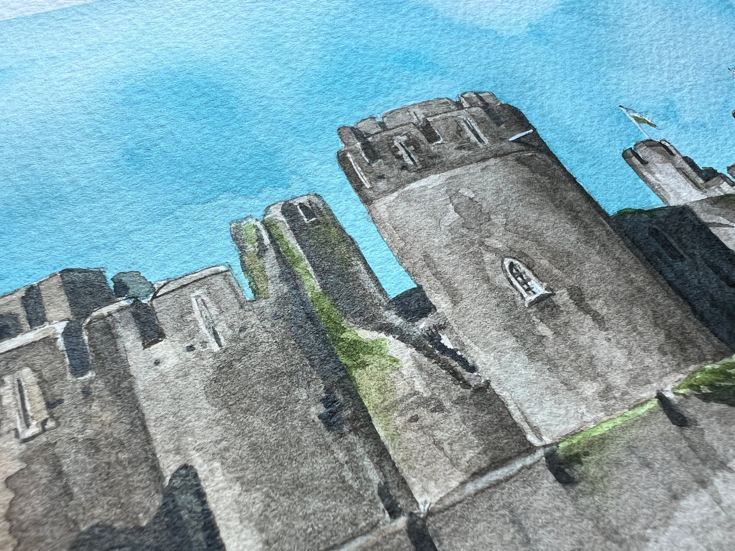 A close up of an original painting of Caerphilly Castle