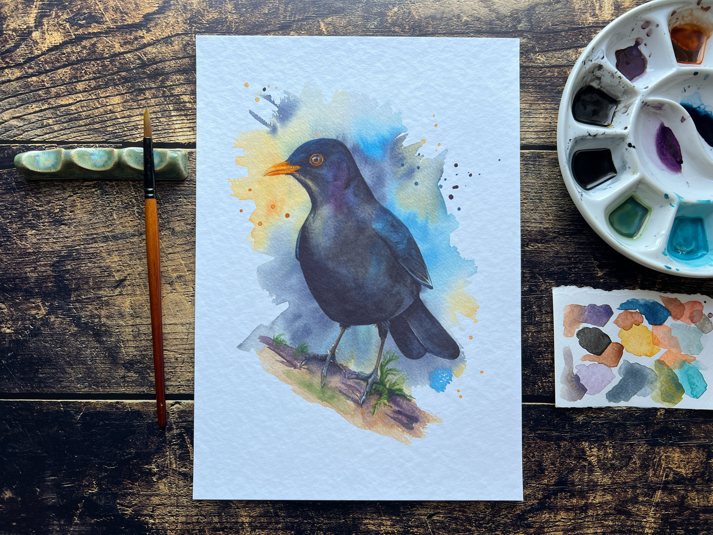 This is a watercolour print of a Eurasian Blackbird, painted in an expressive way.