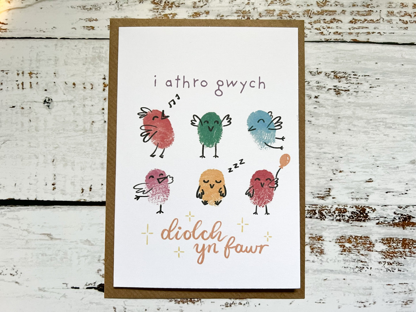 A fingerprinted teacher thank you card which reads 'i athro gwych, diolch yn fawr'.