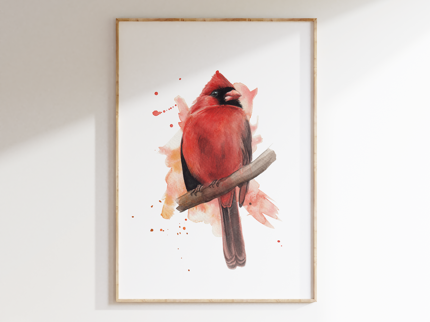 A watercolour print of a male cardinal bird, painted in an expressive way
