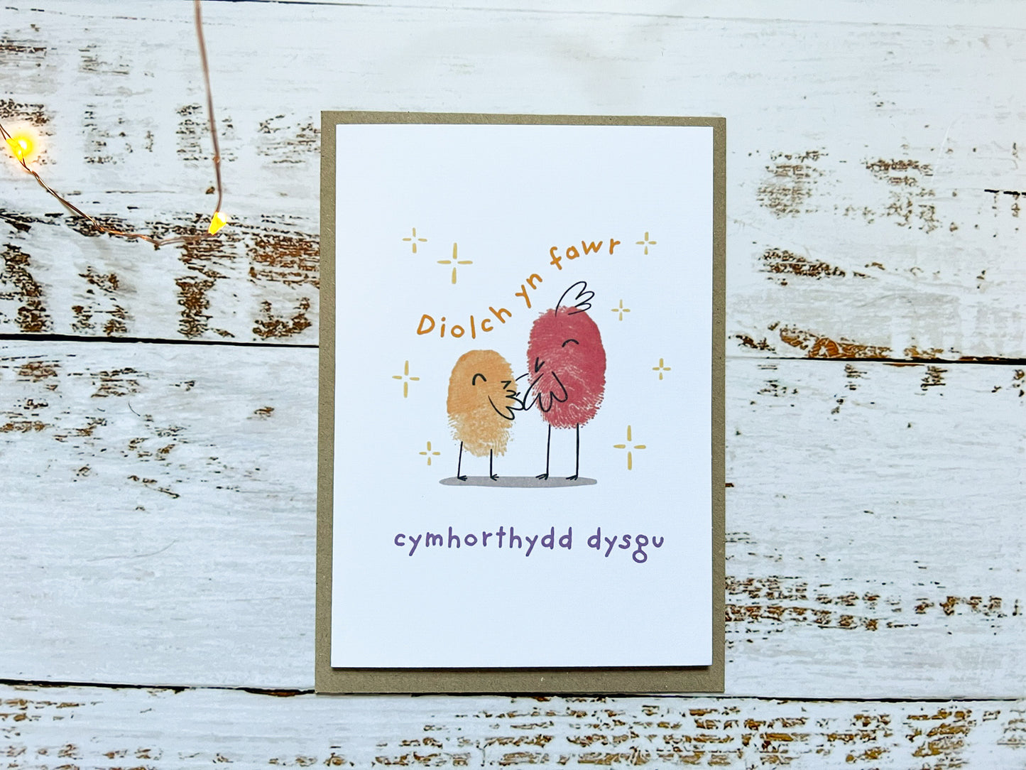 An A6 card of two fingerprinted birds, the card reads 'Diolch yn fawr cymthorthydd dysgu'.