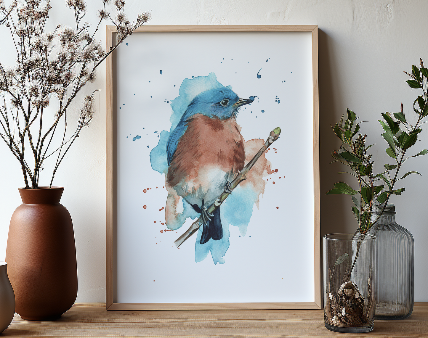 This is a watercolour print of an eastern bluebird, painted in watercolours in an expressive style, complete with watercolour splashes.