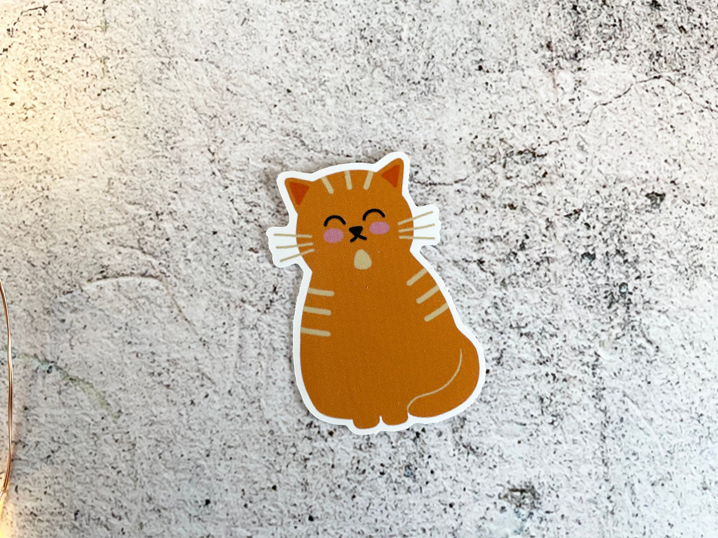 A cute 5cm sticker of a ginger cat