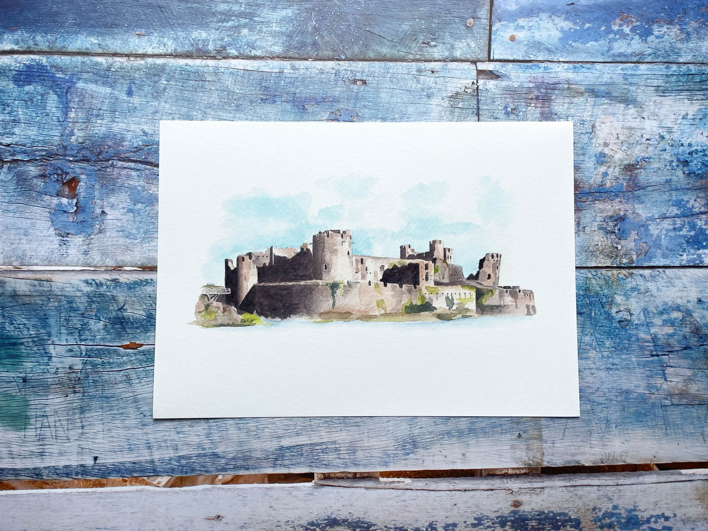 A watercolour print of Caerphilly castle with strong shadows