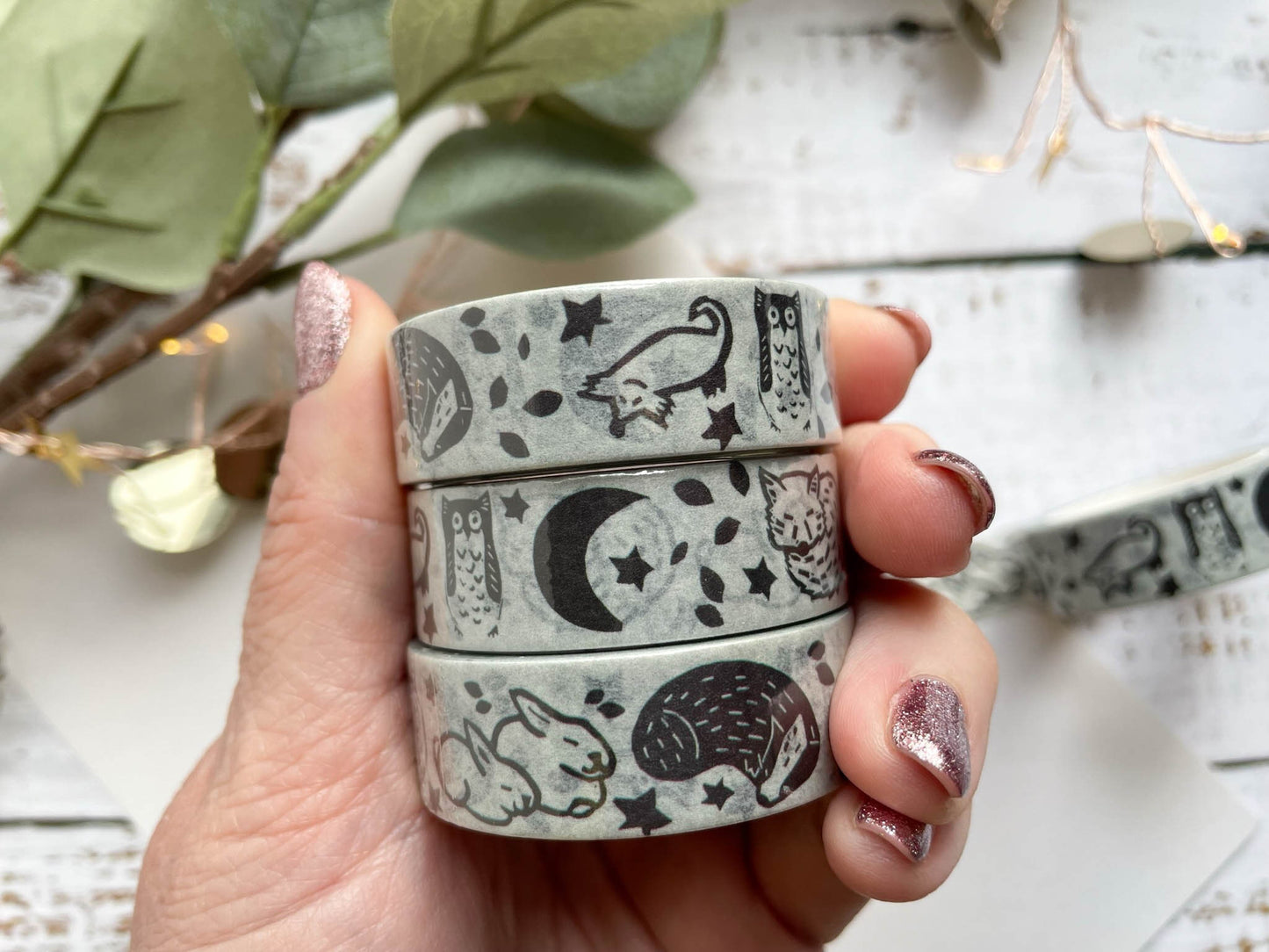 A close up of washi tape that's based on a lino print of woodland animals