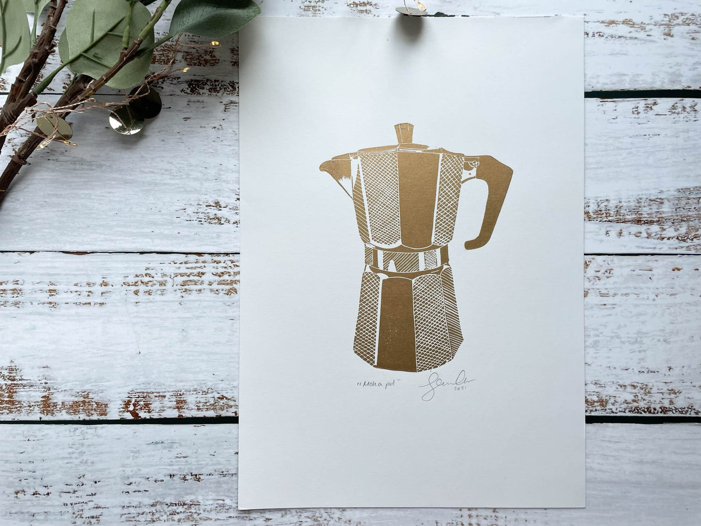 A lino print of a coffee moka pot in copper