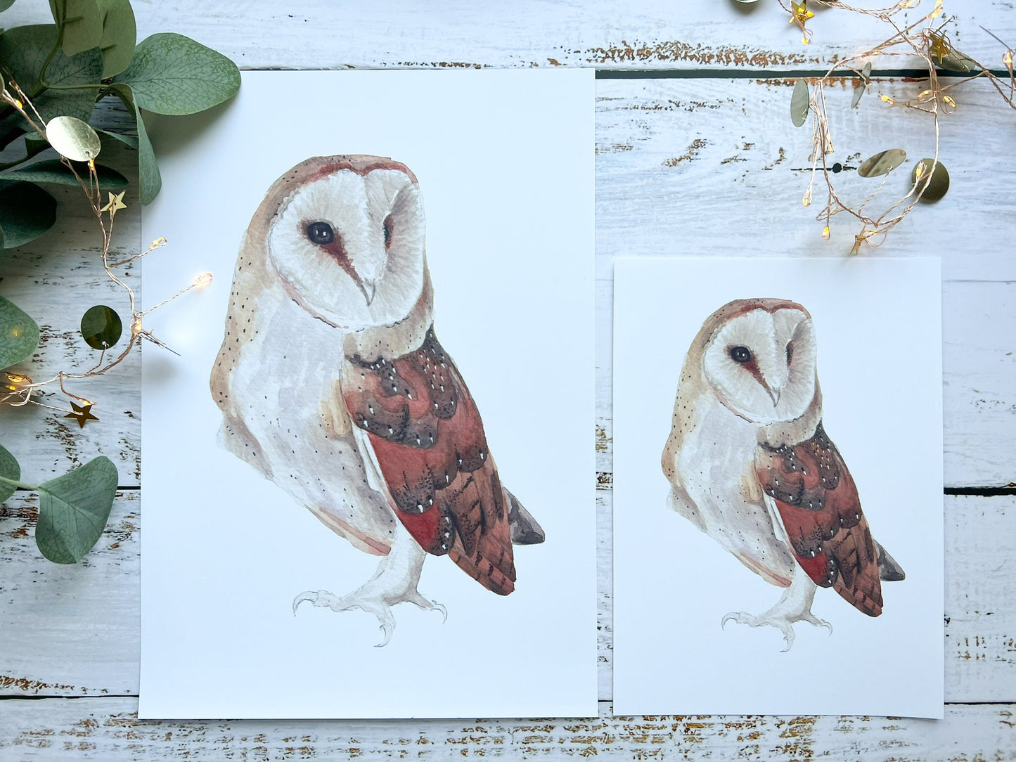 A watercolour print of a barn owl