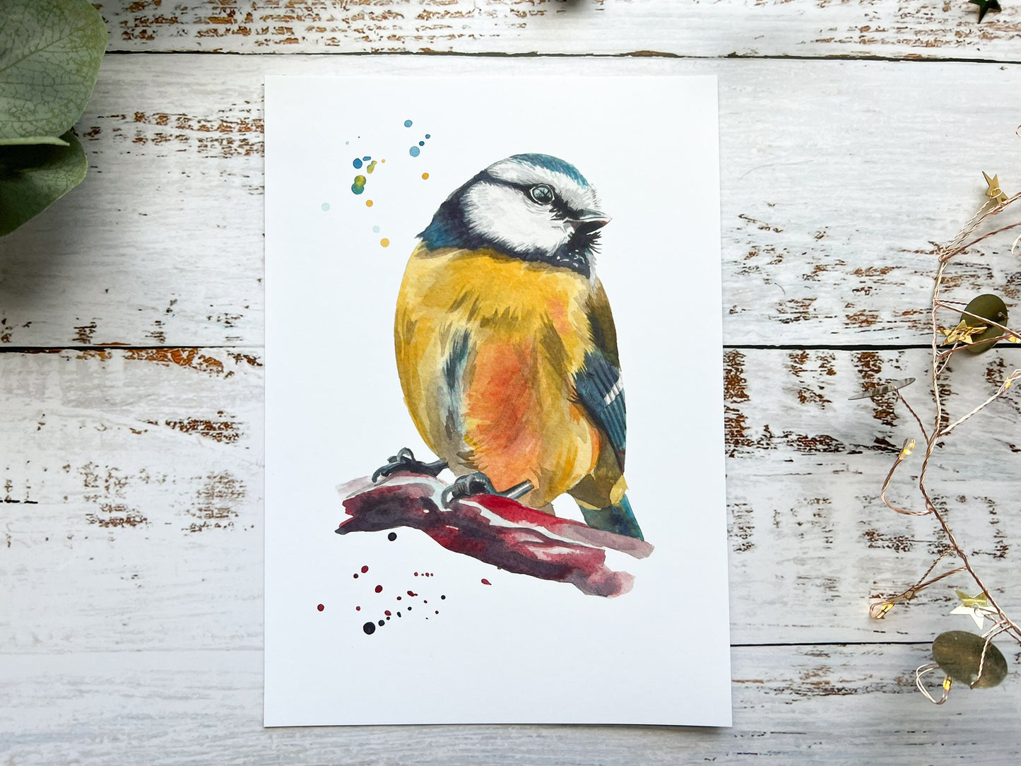 A watercolour print of a blue tit up close