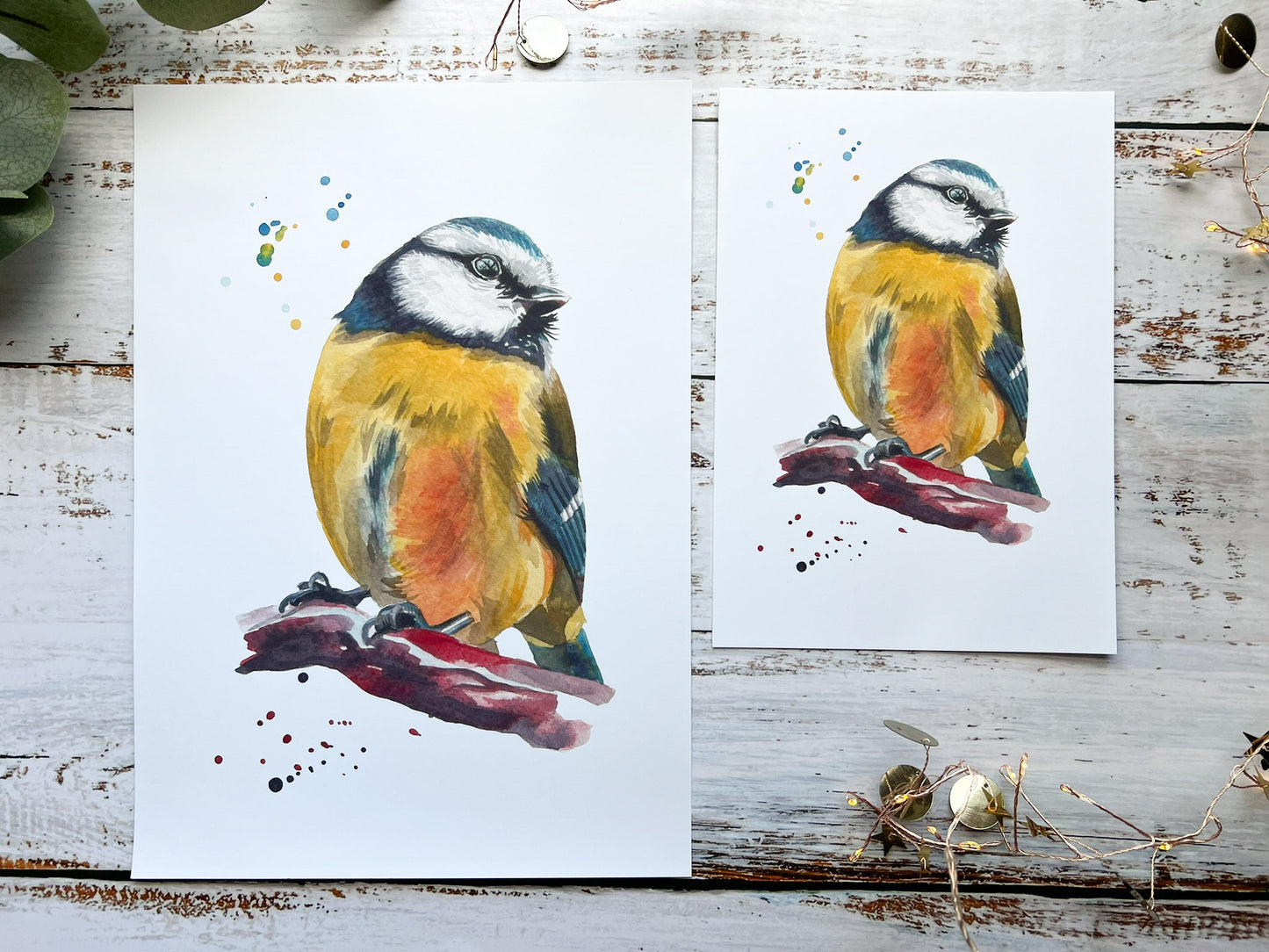 A watercolour print of a blue tit up close