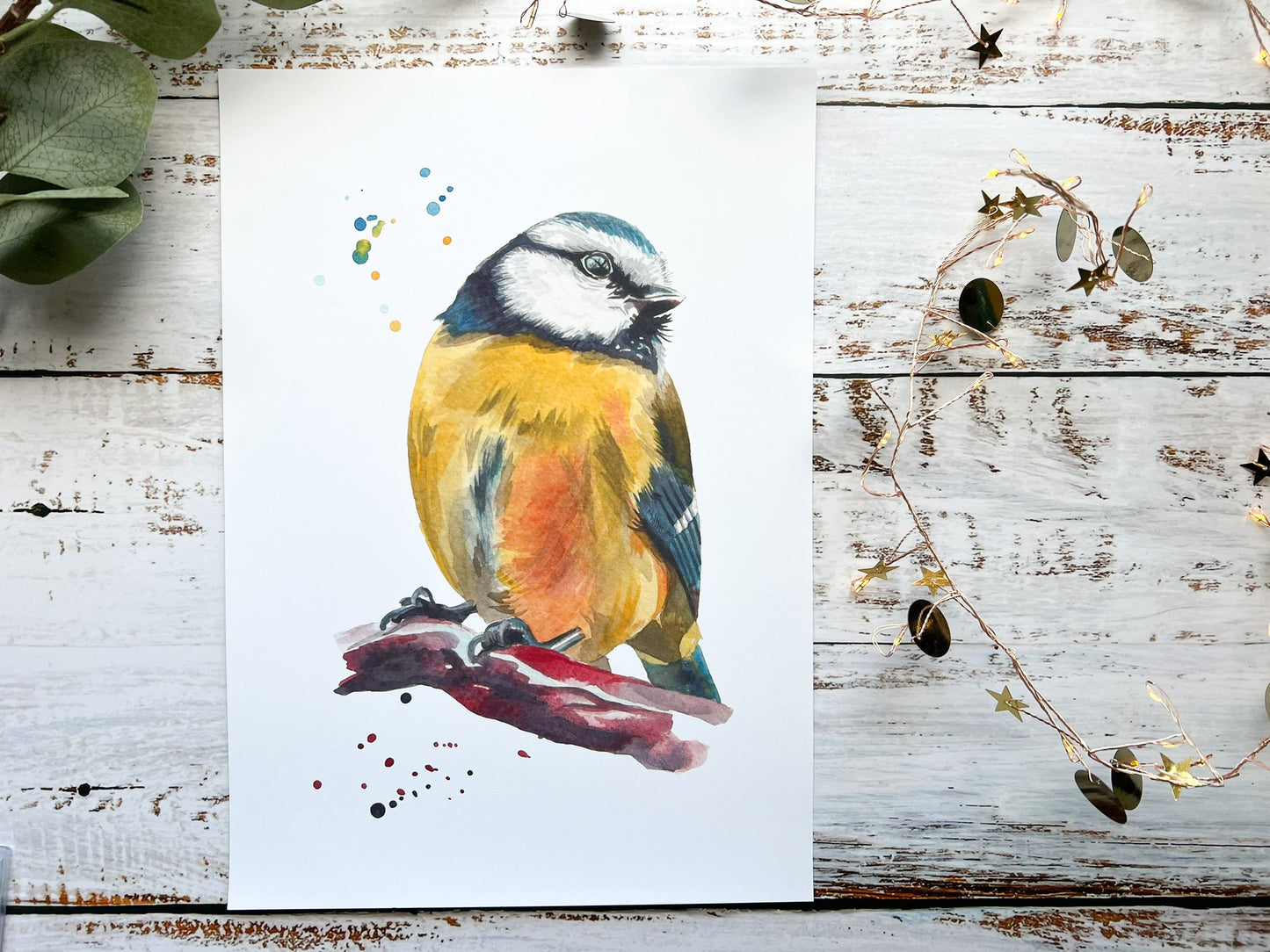 A watercolour print of a blue tit up close