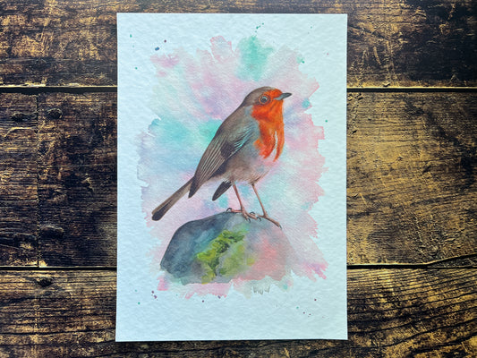 A watercolour print of a robin surrounded by Spring colours