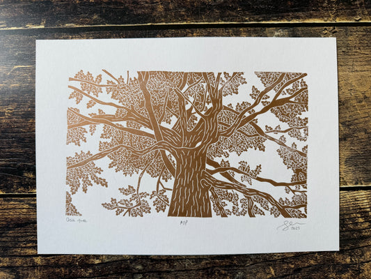 A photo of an oak tree lino print in copper ink