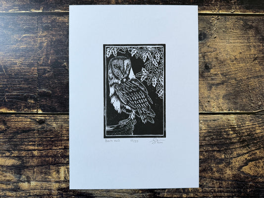 A lino print of a barn owl on a headstone
