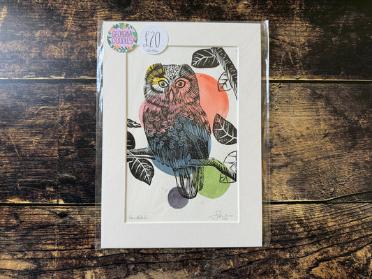 A mixed media lino print of an owl