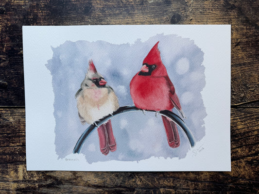 An art print of a male & female cardinal