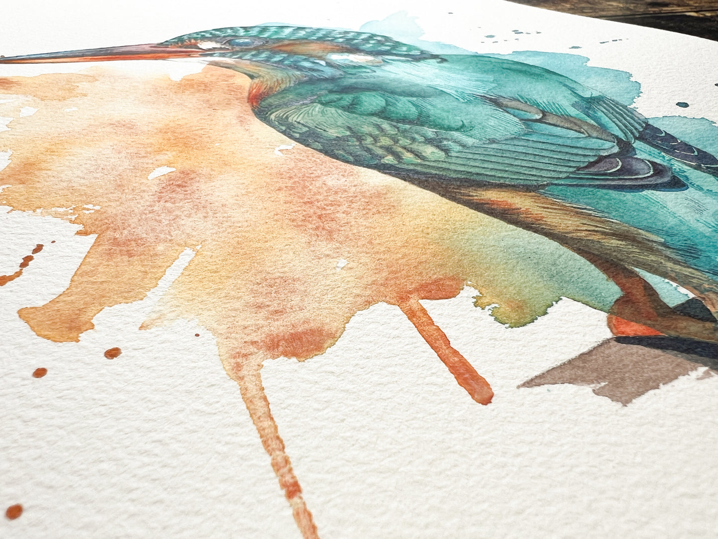 Watercolor painting of a bird on textured paper