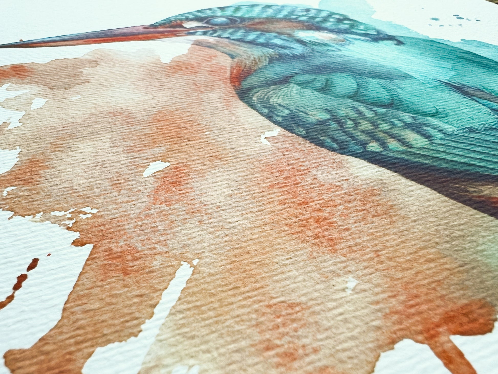 Close-up of a watercolor painting of a bird with a focus on its feathers.