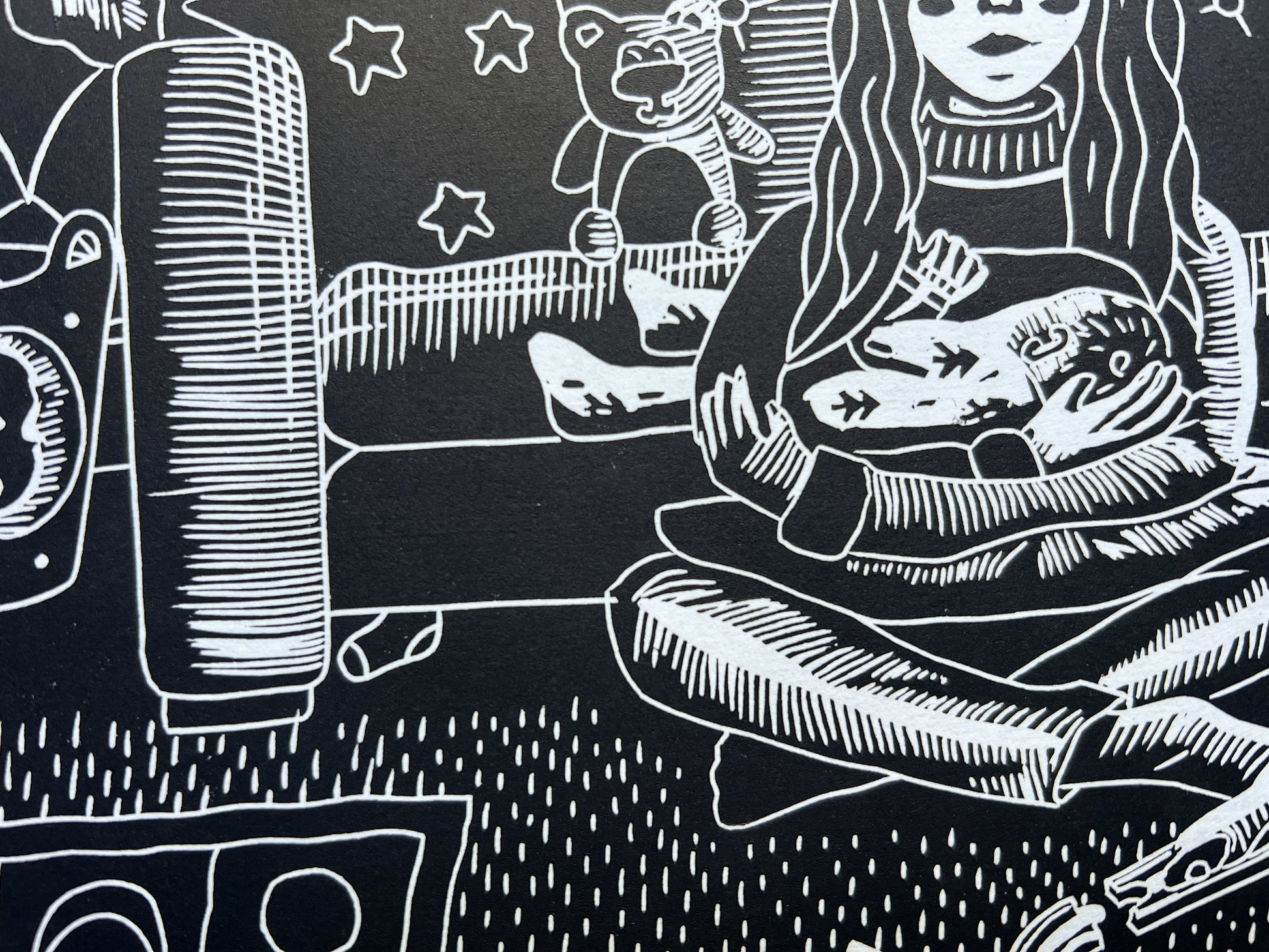 A close up of the baby breastfeeding, and the sock lost under the sofa