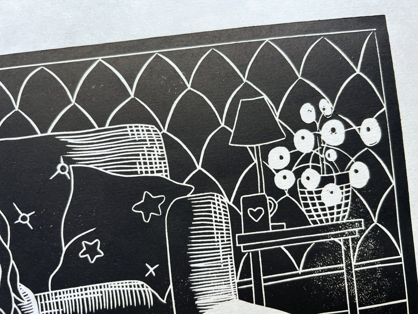 A close up of the table, plant and wall