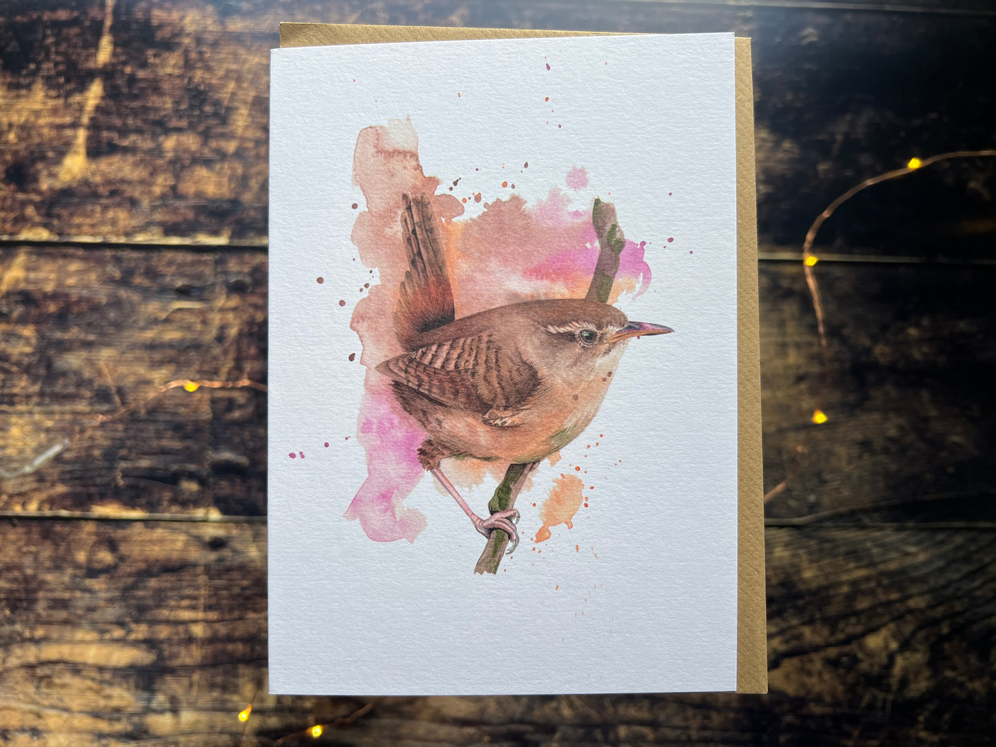 A photo of a greetings card with a watercolour wren on the front