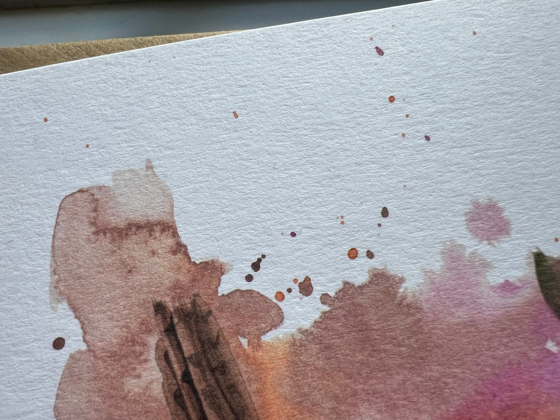 Watercolor painting on textured paper with a focus on color and texture.