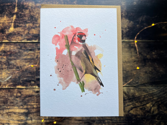A picture of a greetings card with a watercolour goldfinch on the front