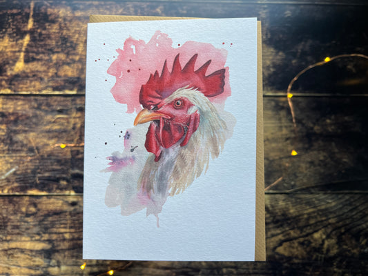 A photo of a greetings card with a watercolour rooster on the front