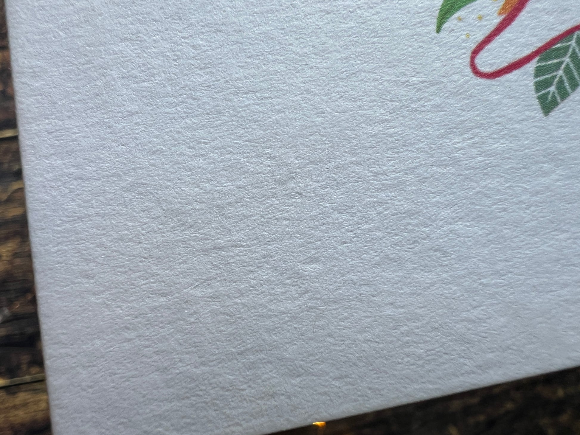 Close-up of textured white card.