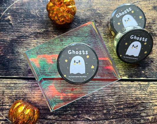 A roll of Ghost themed washi tape on a wooden background