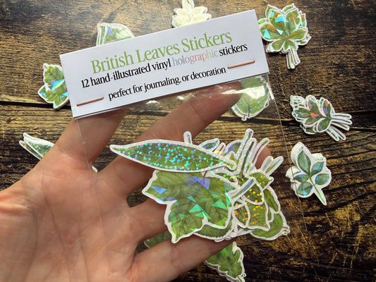 A photo of a pack of vinyl British Leaves stickers covered in a holographic vinyl