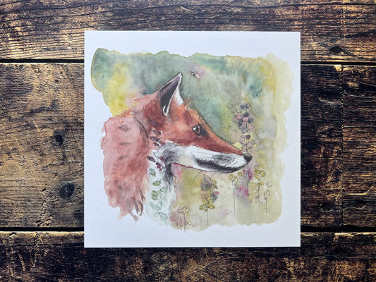 Watercolor painting of a fox on a wooden surface