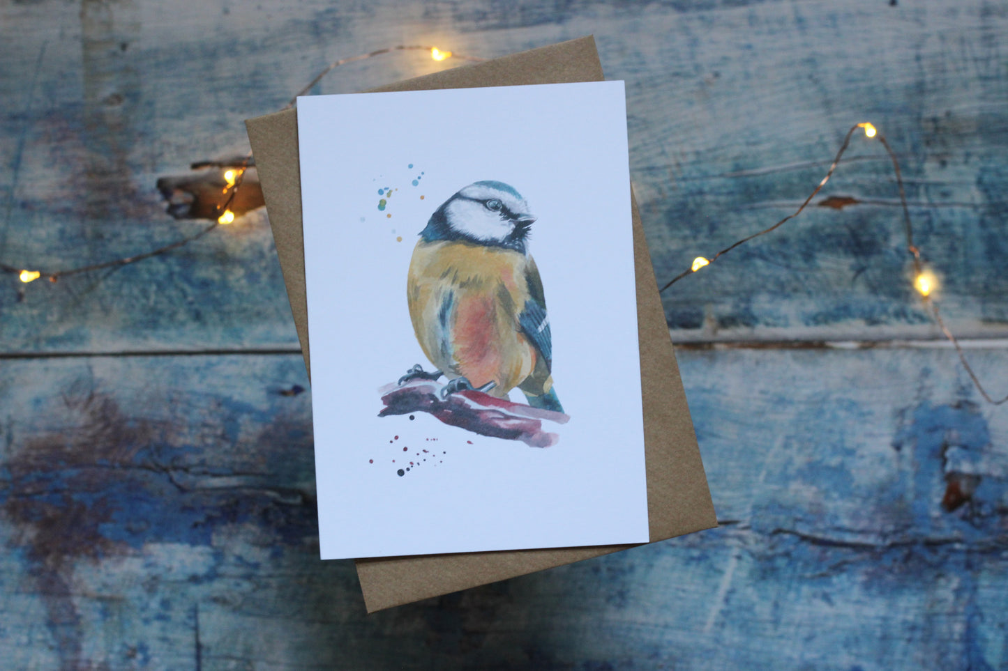 An A6 card and brown kraft envelope featuring a blue tit