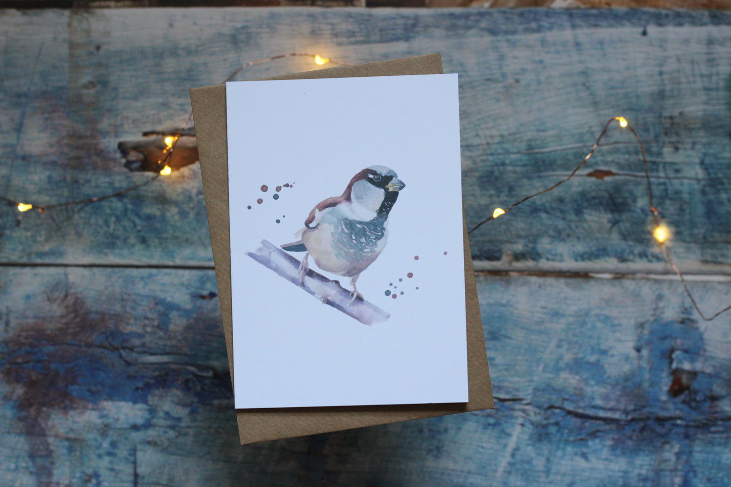 An A6 card and brown kraft envelope featuring a house sparrow
