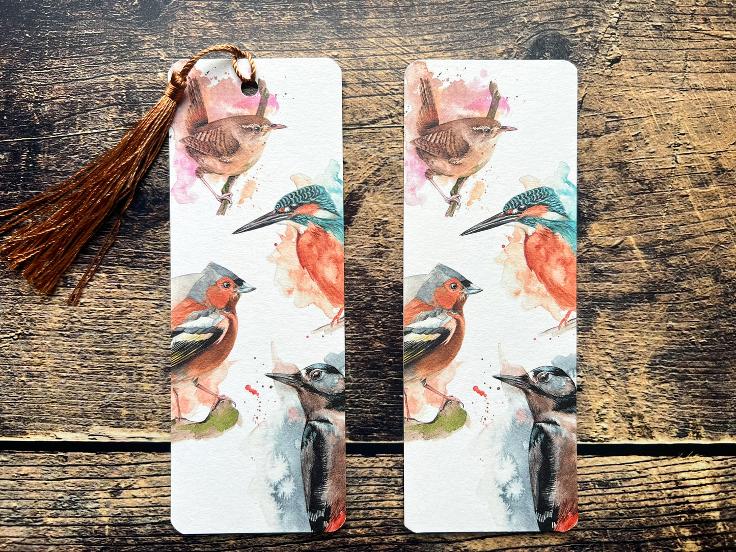 A photo of a bookmark of a collection of expressively painted birds