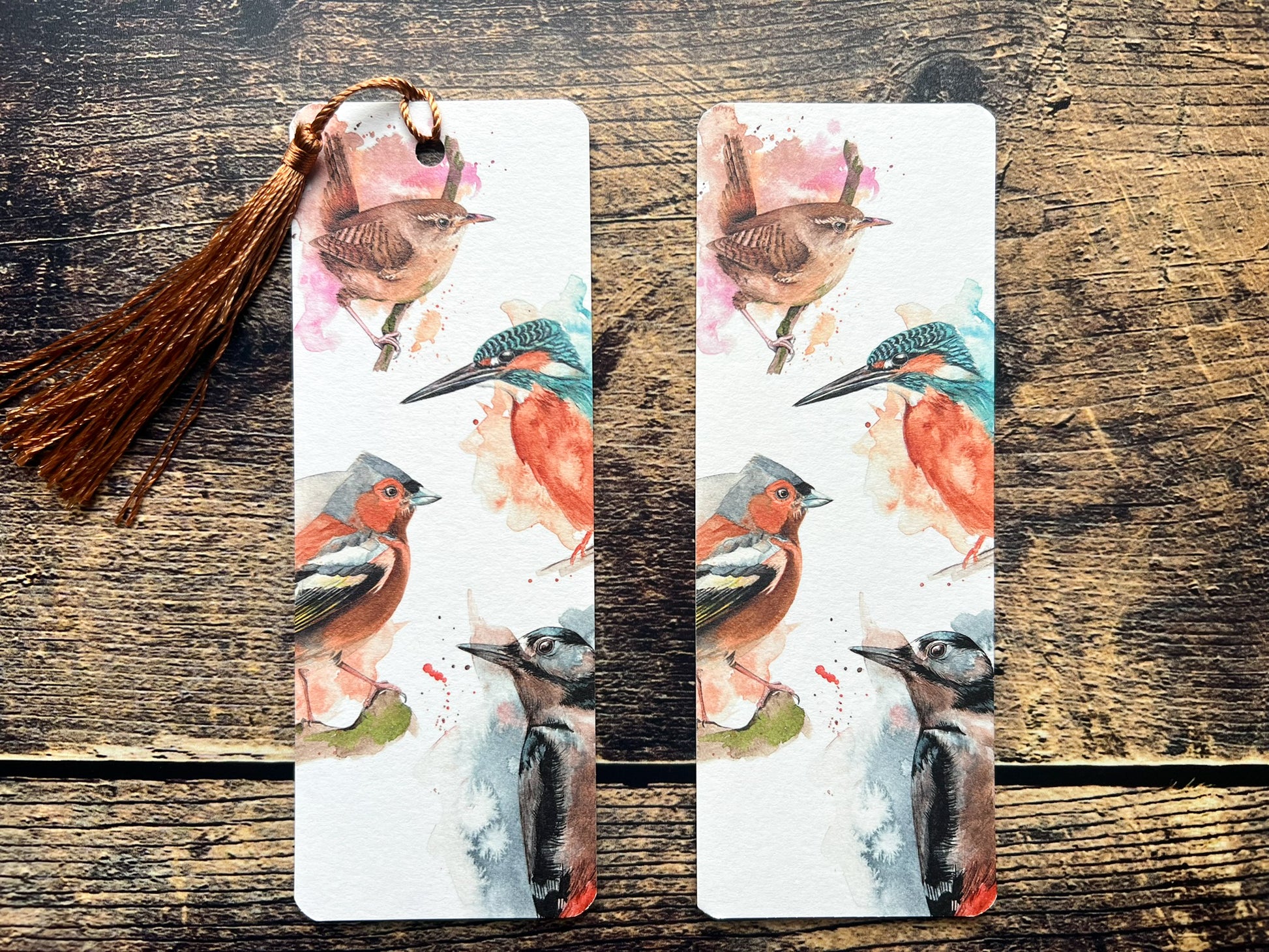 A photo of a bookmark of a collection of expressively painted birds