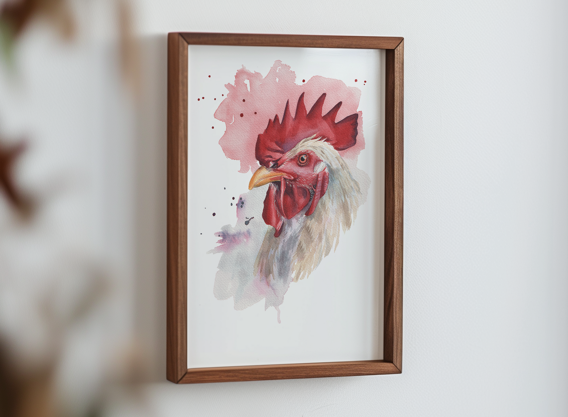 A watercolour print of a rooster in a mocked up frame