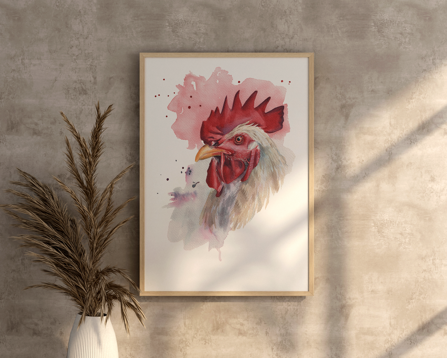 A watercolour print of a rooster in a mocked up frame