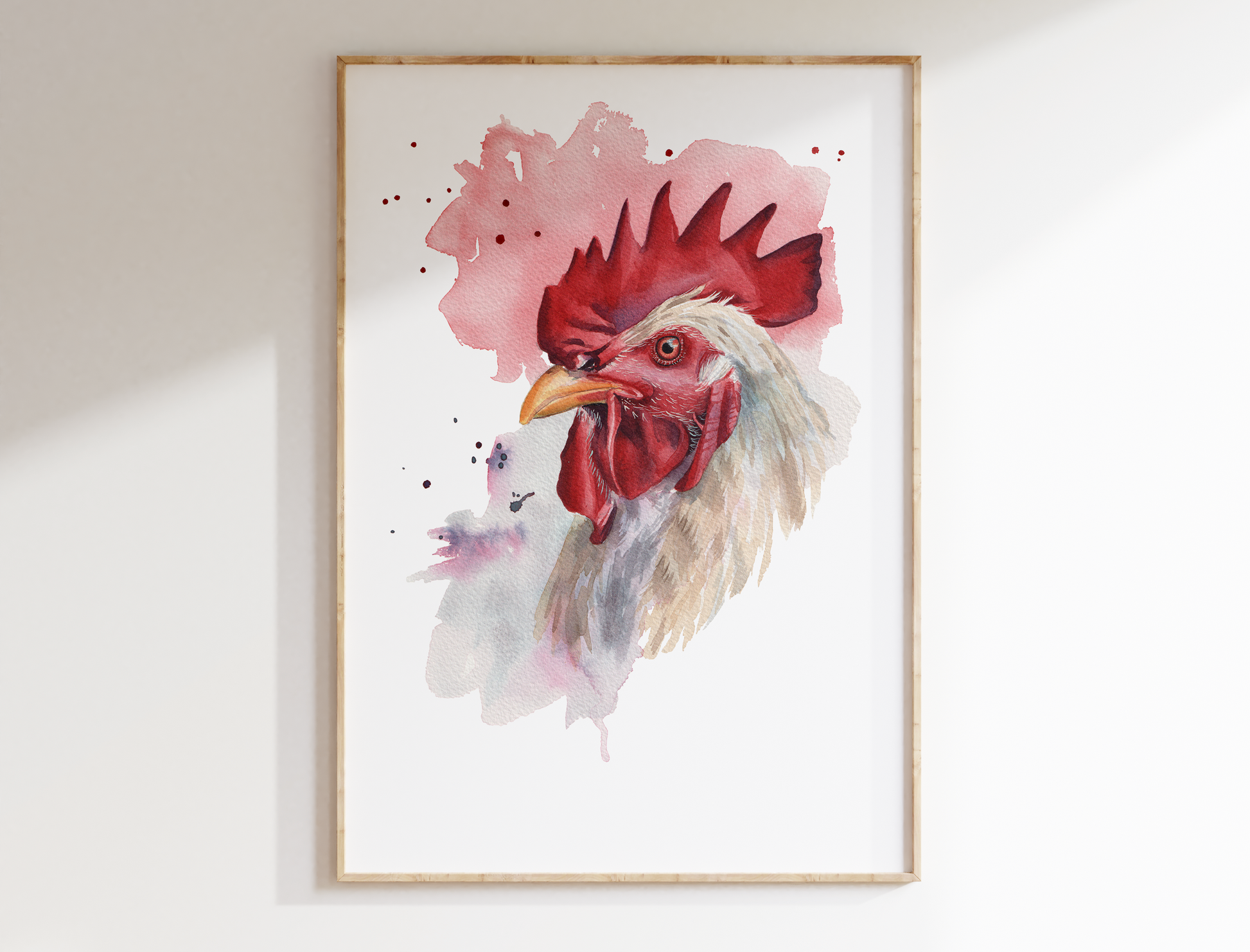 A watercolour print of a rooster in a mocked up frame
