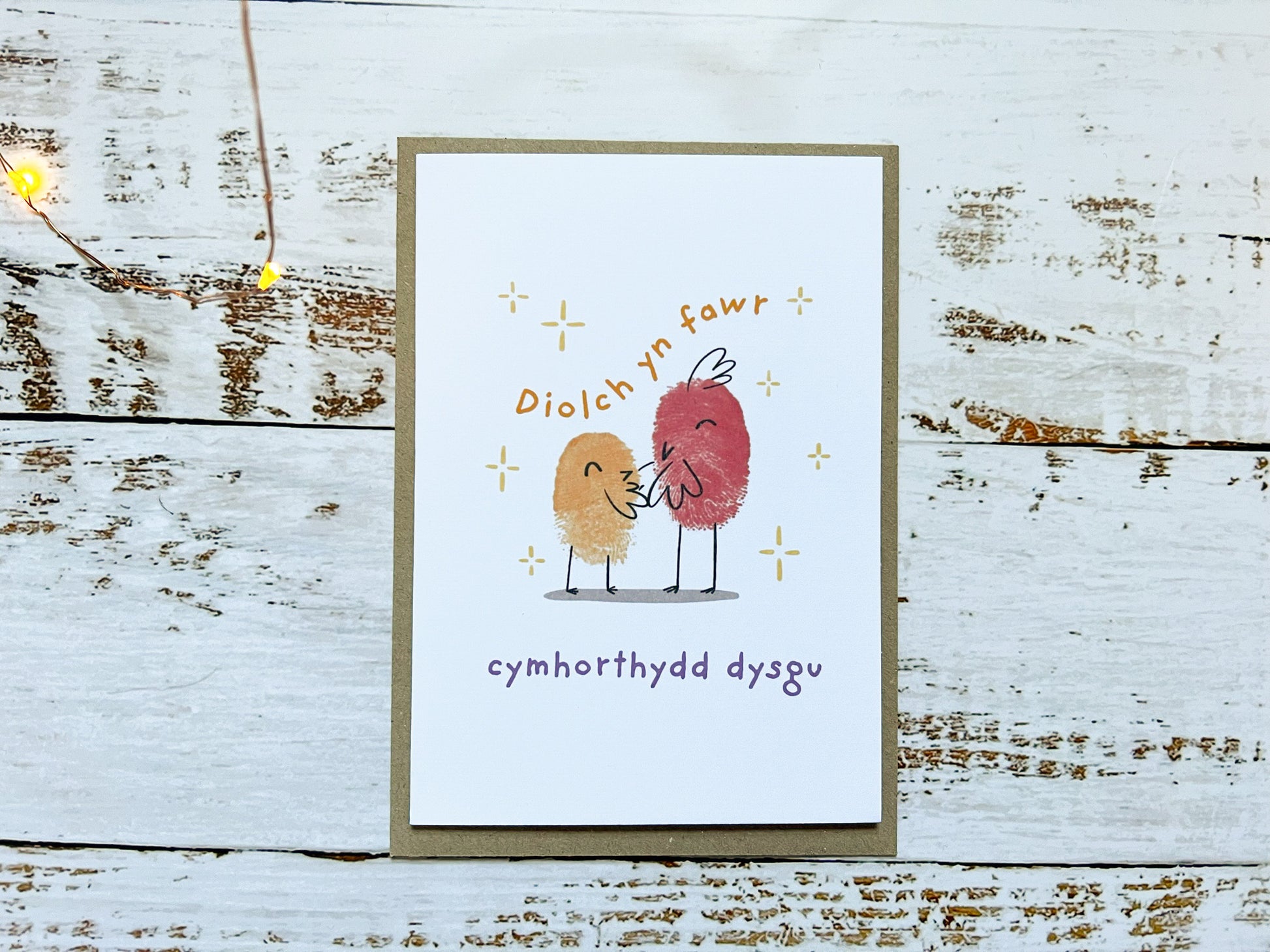 An A6 card of two fingerprinted birds, the card reads 'Diolch yn fawr cymthorthydd dysgu'.