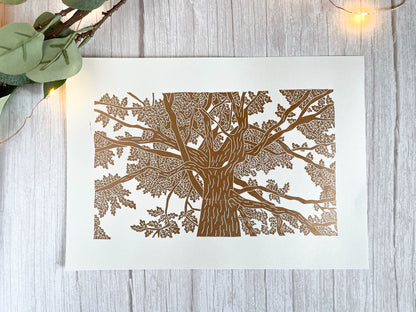 A lino print of an oak tree as viewed from standing under it and looking up in copper