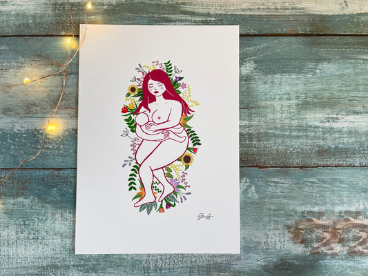 A print of digital art of a naked mother breastfeeding her baby while laying on a bed of flowers and leaves