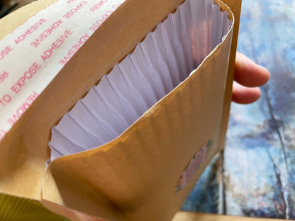 An enviro corrugated envelope to ship the keyrings in securely