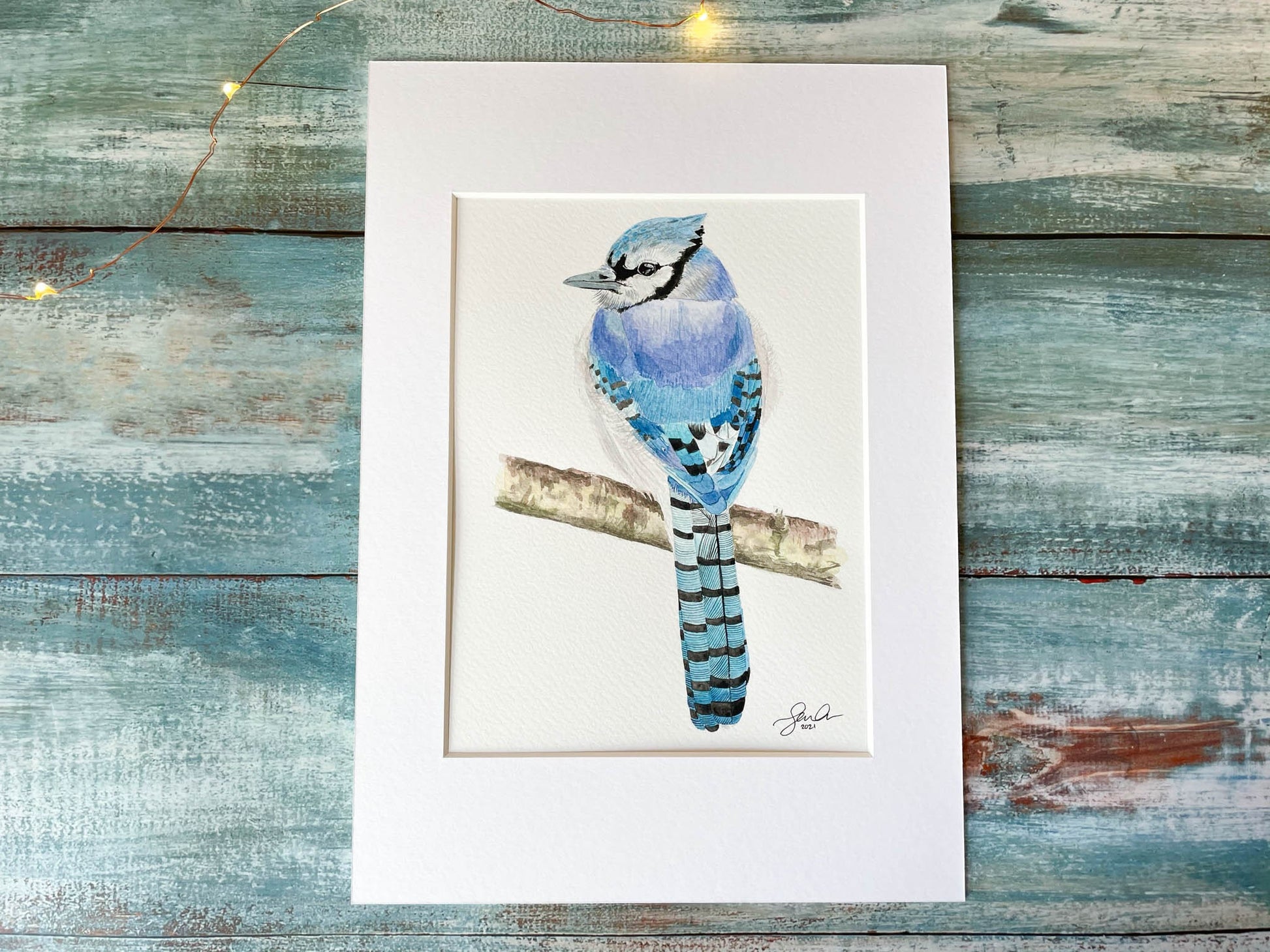 An original mounted watercolour painting of a blue jay