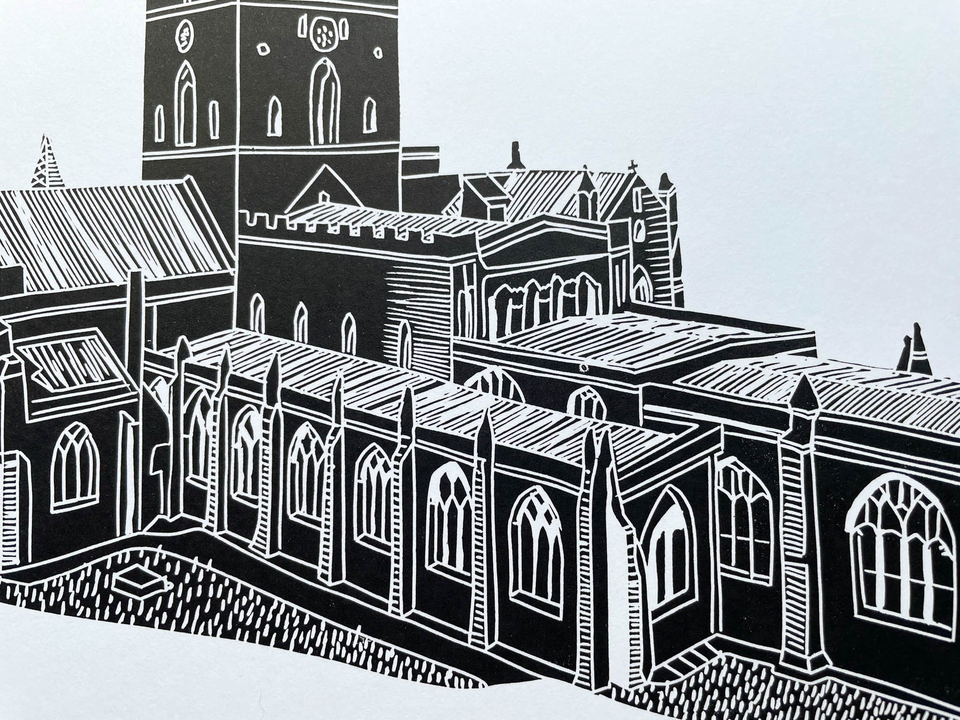 A lino print of St Davids Cathedral in Pembrokeshire in black on A4 white paper