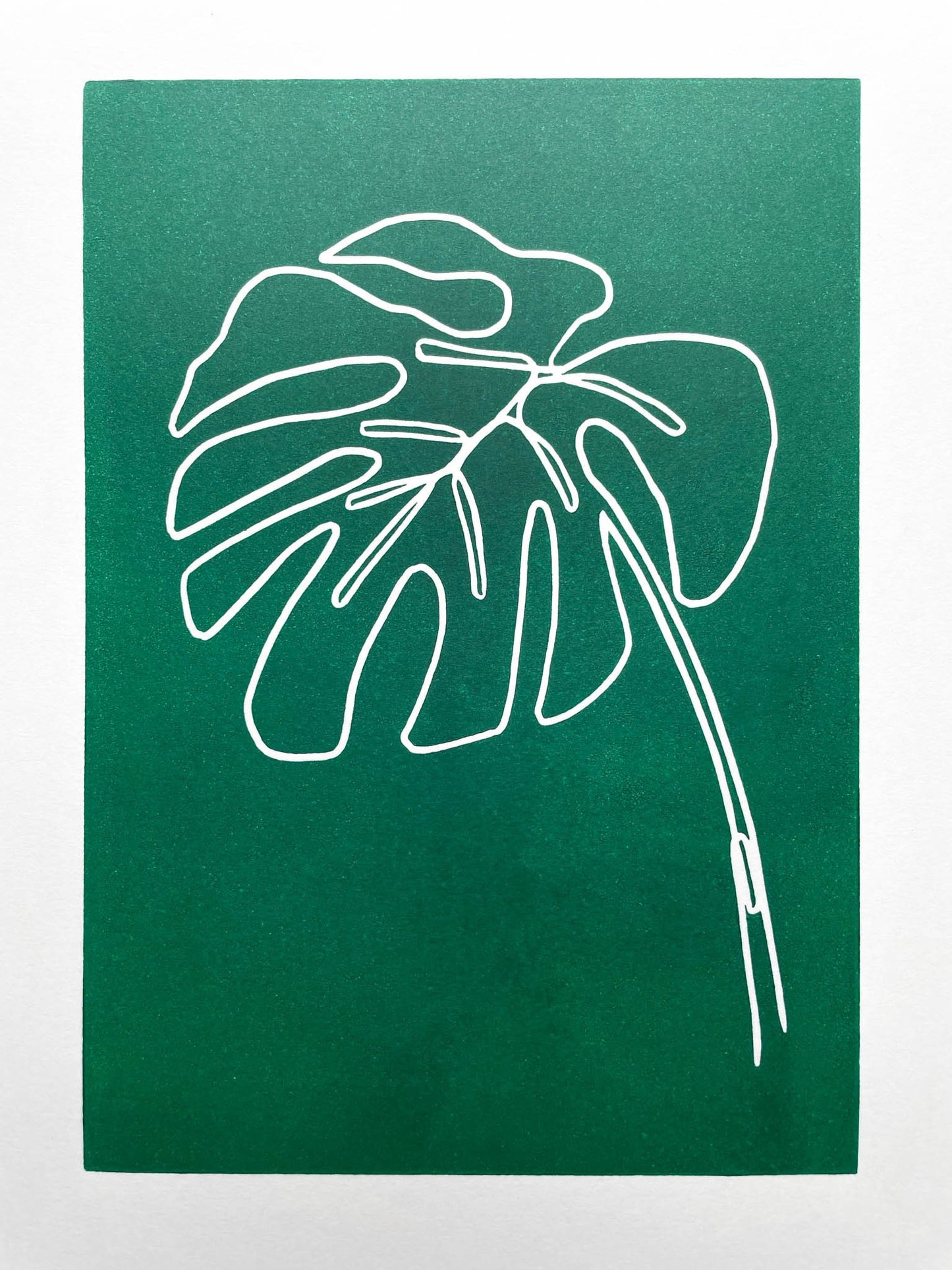 A continuous line lino print of a monstera plant leaf on a green background