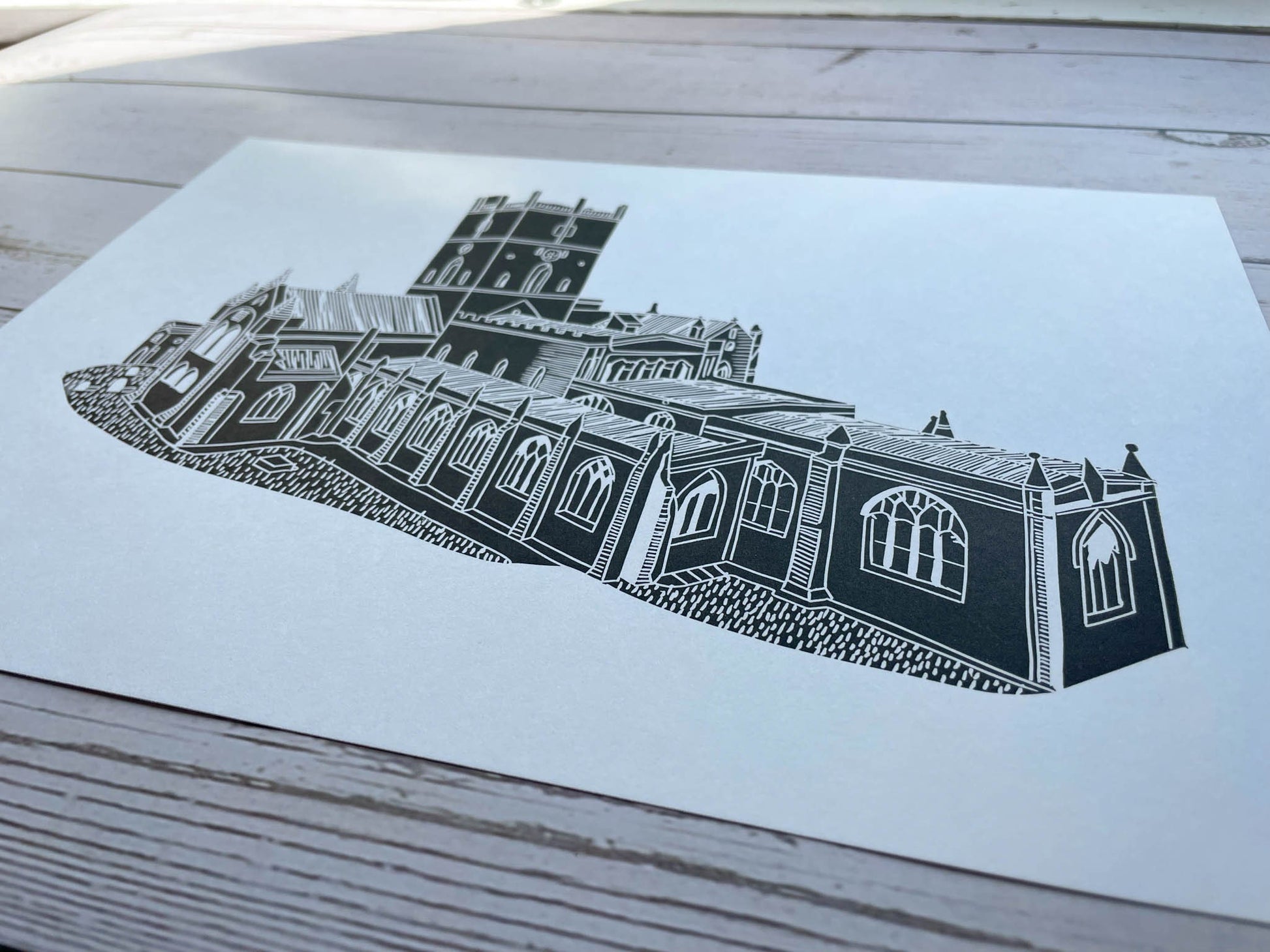 A lino print of St Davids Cathedral in Pembrokeshire in black on A4 white paper